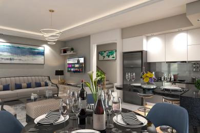 Alanyan asunto: Avoin olohuone ja ruokailutila, jossa on moderni keittiö, tyylikkäät pinnat ja lämmin, kutsuva valaistus.