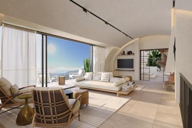 Alanya property living room featuring neutral tones, large windows, and stunning mountain views, creating a serene atmosphere.