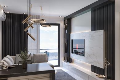 The living room of this Alanya property features modern lighting, a marble TV wall, dark wood accents, and access to a balcony, creating a stylish atmosphere.